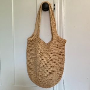Peach colored straw knit bag